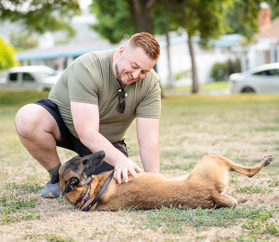 Man interacting with a therapy dog